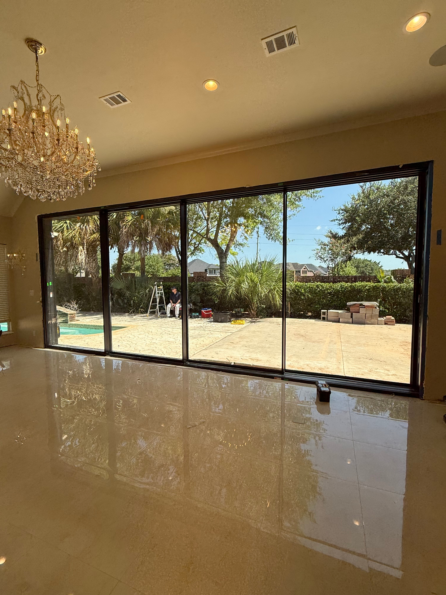 Houston TX 24-foot 4-panel super slim aluminum sliding door — full rear wall of glass overlooking backyard and pool