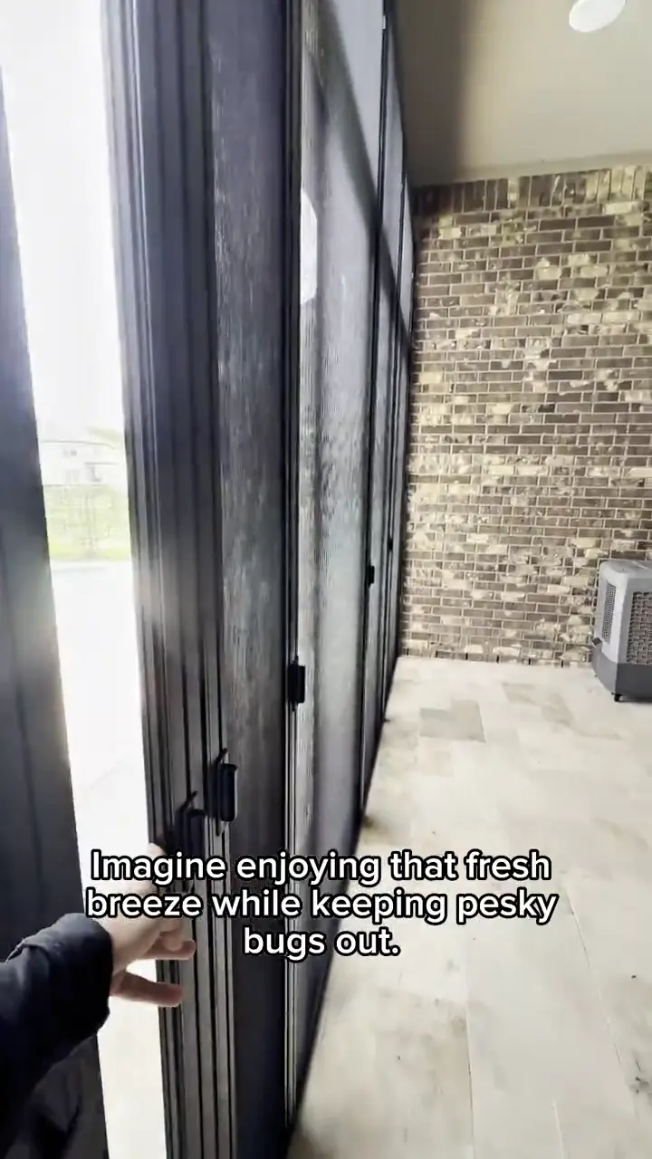 Aluminum-frame retractable screen door installed on a large patio door opening