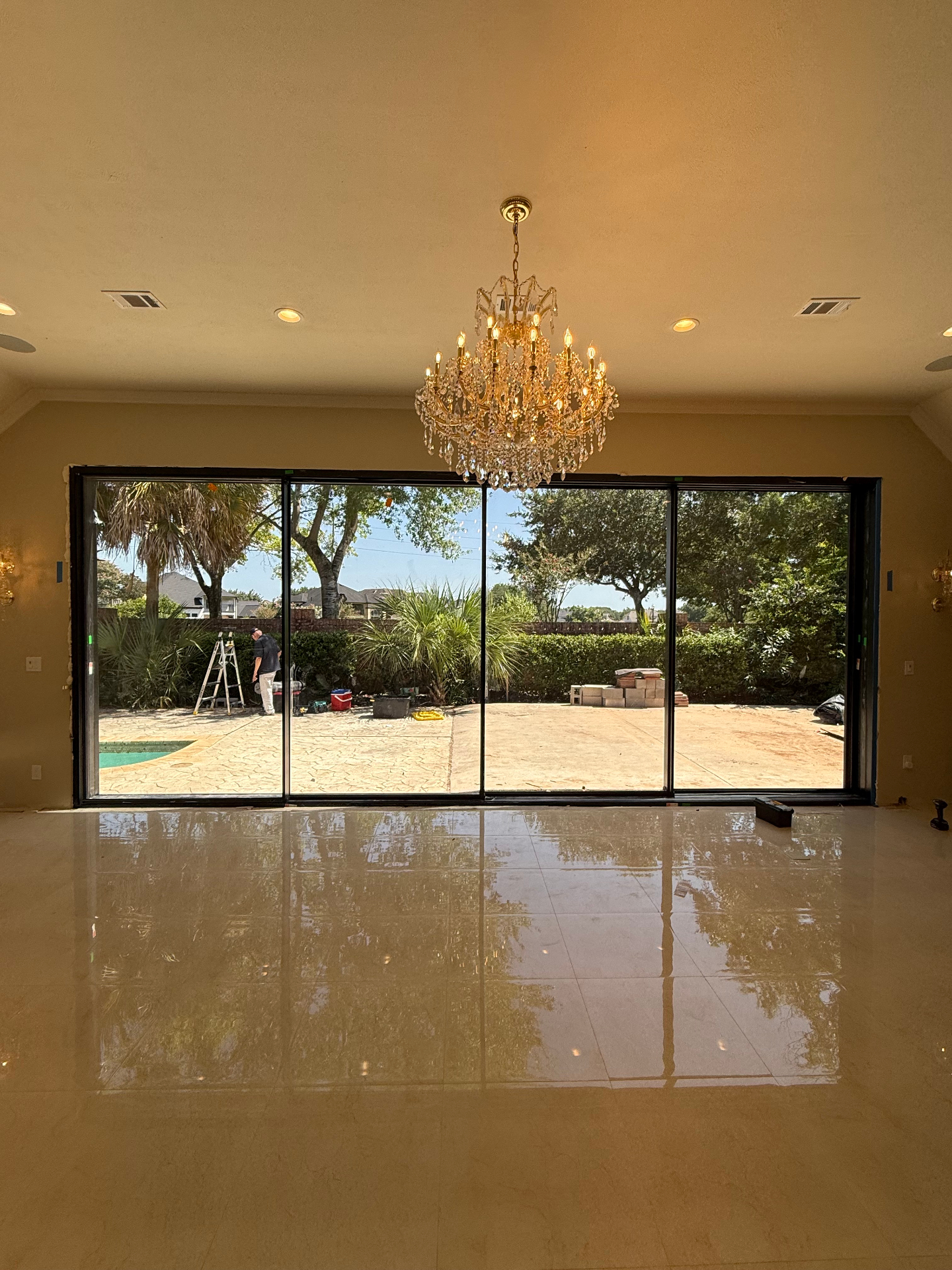 Houston TX 24-foot 4-panel super slim aluminum sliding door — full rear wall of glass overlooking backyard and pool