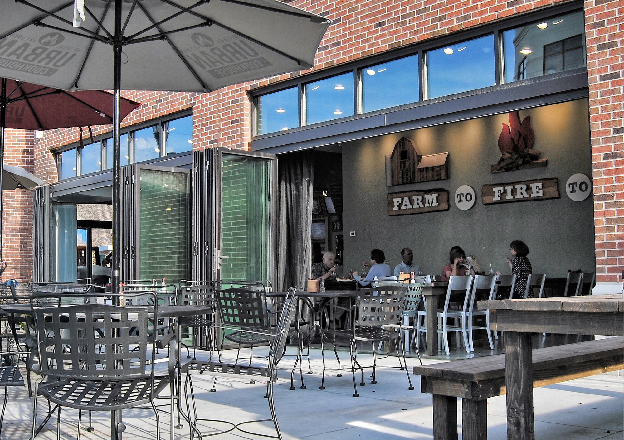 Bifold doors open at restaurant patio — Farm to Fire coffeeshop commercial installation