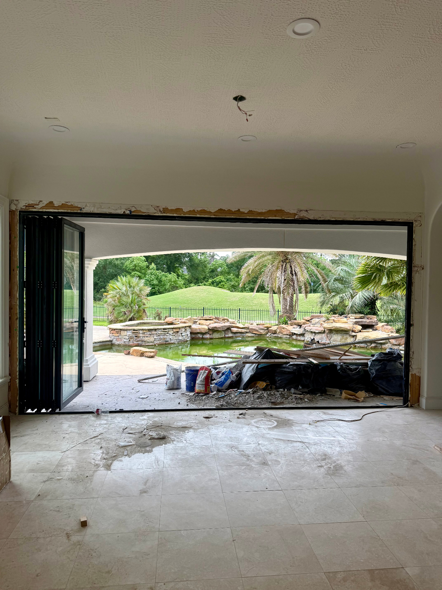 Spring TX 16-foot aluminum bifold door fully open creating seamless indoor-outdoor transition
