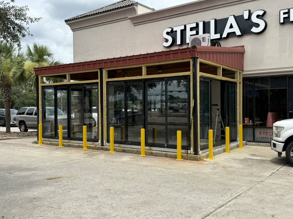 Sliding Doors project — Stella's Restaurant: Patio Enclosure – 4 Season Open-Air Serving Area · Pearland, TX