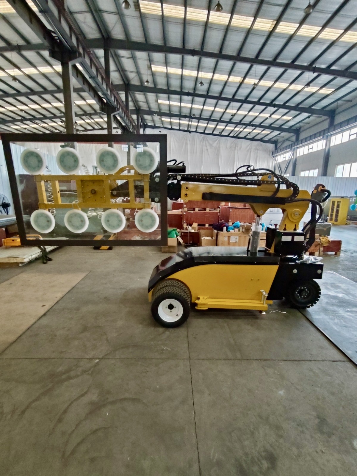 Vacuum lifter holding large glass panel