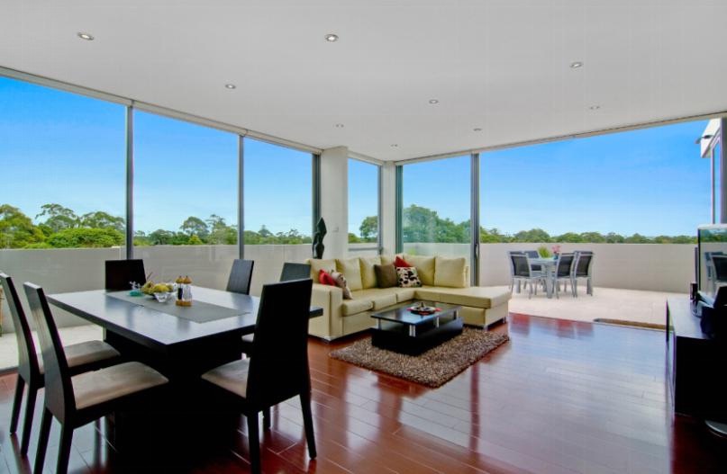 Modern living room with panoramic sliding glass doors and natural light